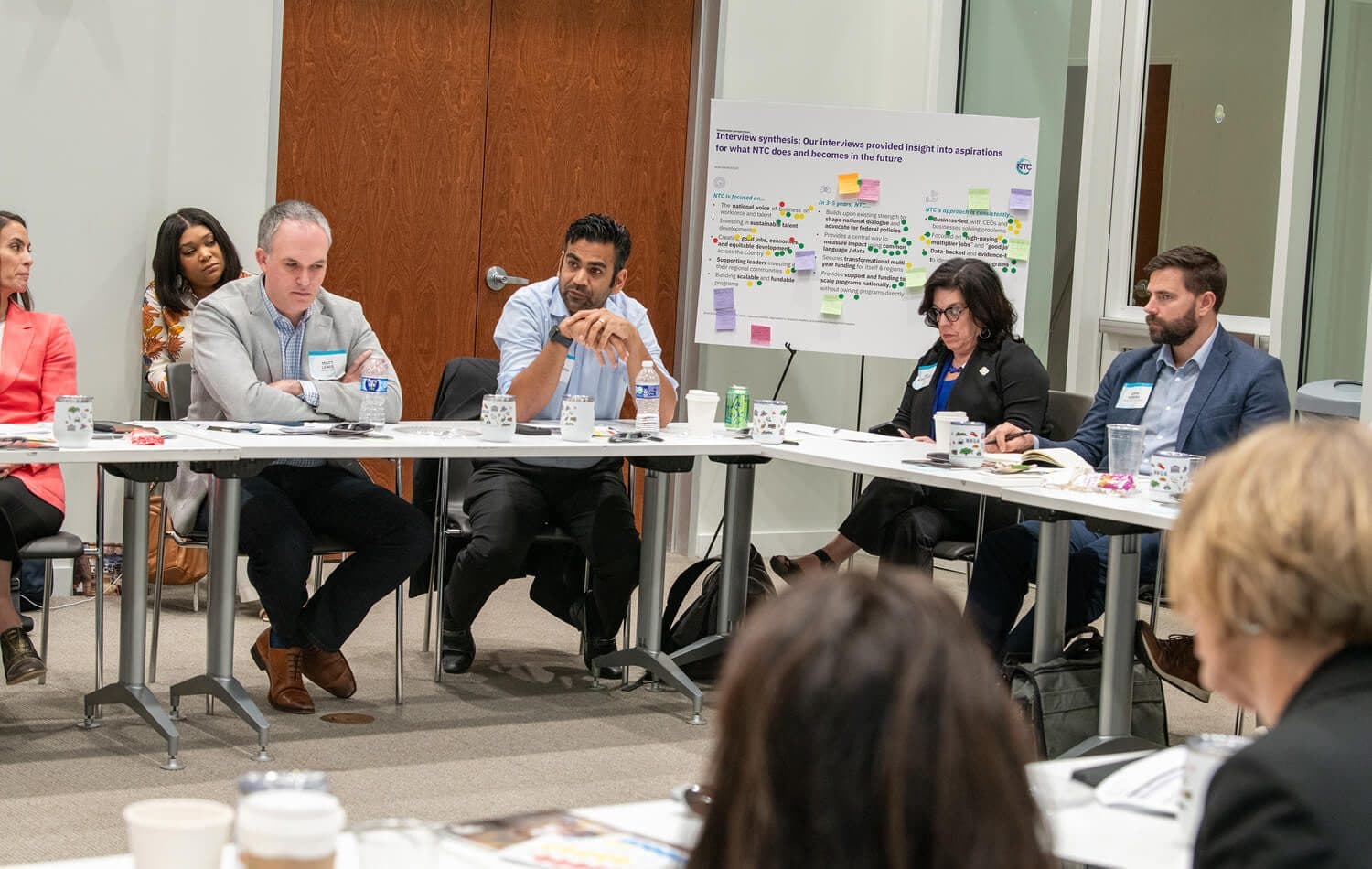 Member leaders working through a problem at a roundtable